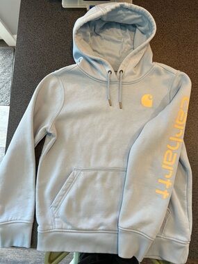 Carhartt Pale Blue Hoodie with Light  Yellow/Cream Logo and Sleeve Script